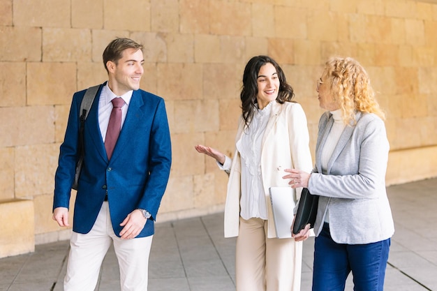 business professionals engaged friendly conversation while walking lifestyle business 1031763 1829